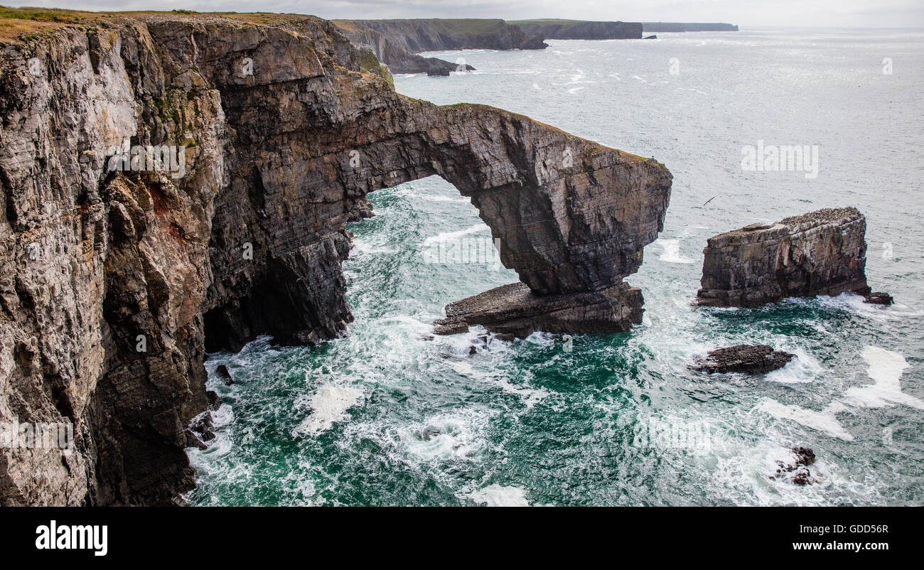 The Green Bridge of Wales near Castlemartin on the Pembrokeshire coast is a natural arch in the carboniferous limestone cliffs Stock Photo