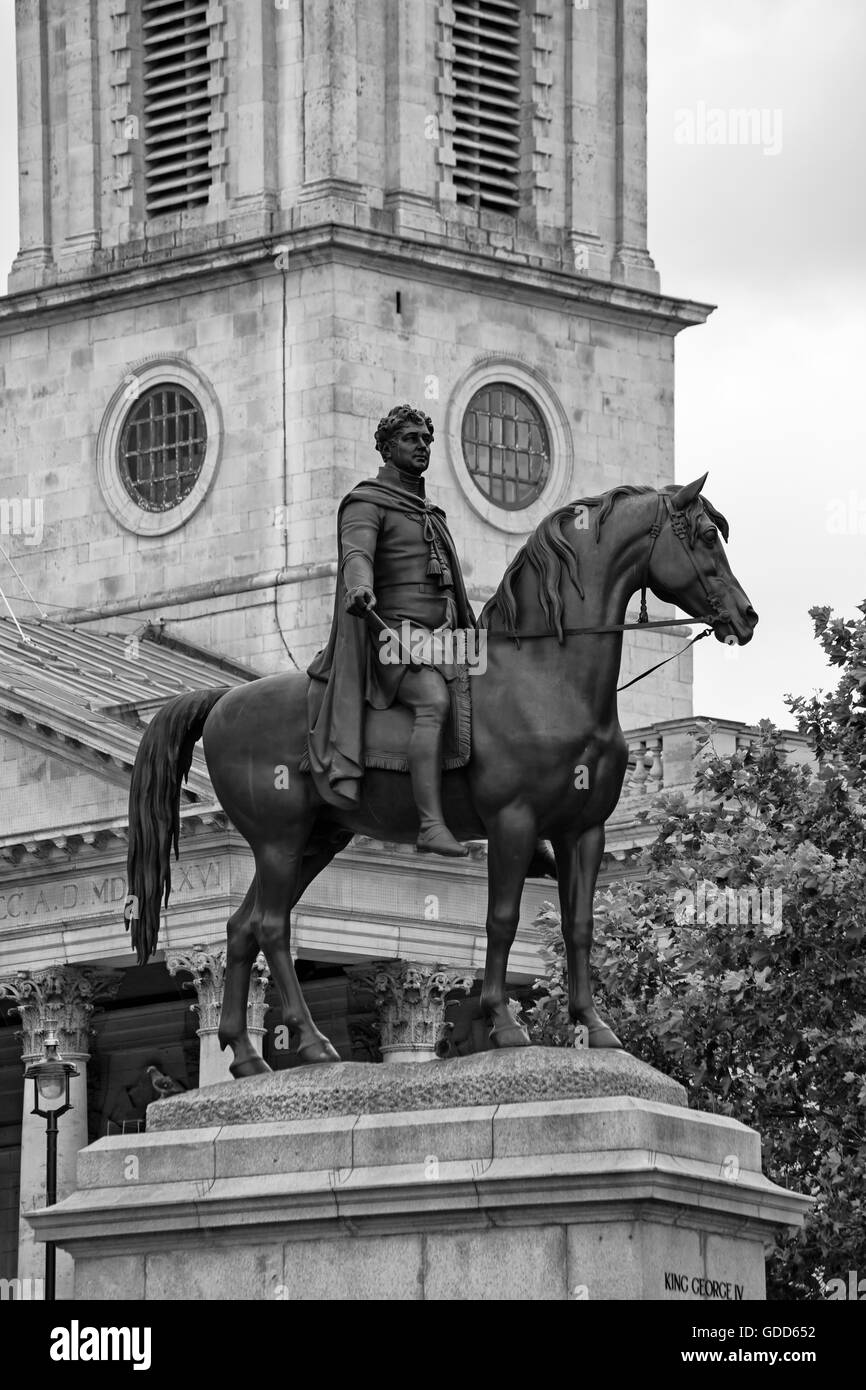 Statue of King George IV on horseback with St Martin in the Fields Church behind in Trafalgar Square, London in July Stock Photo
