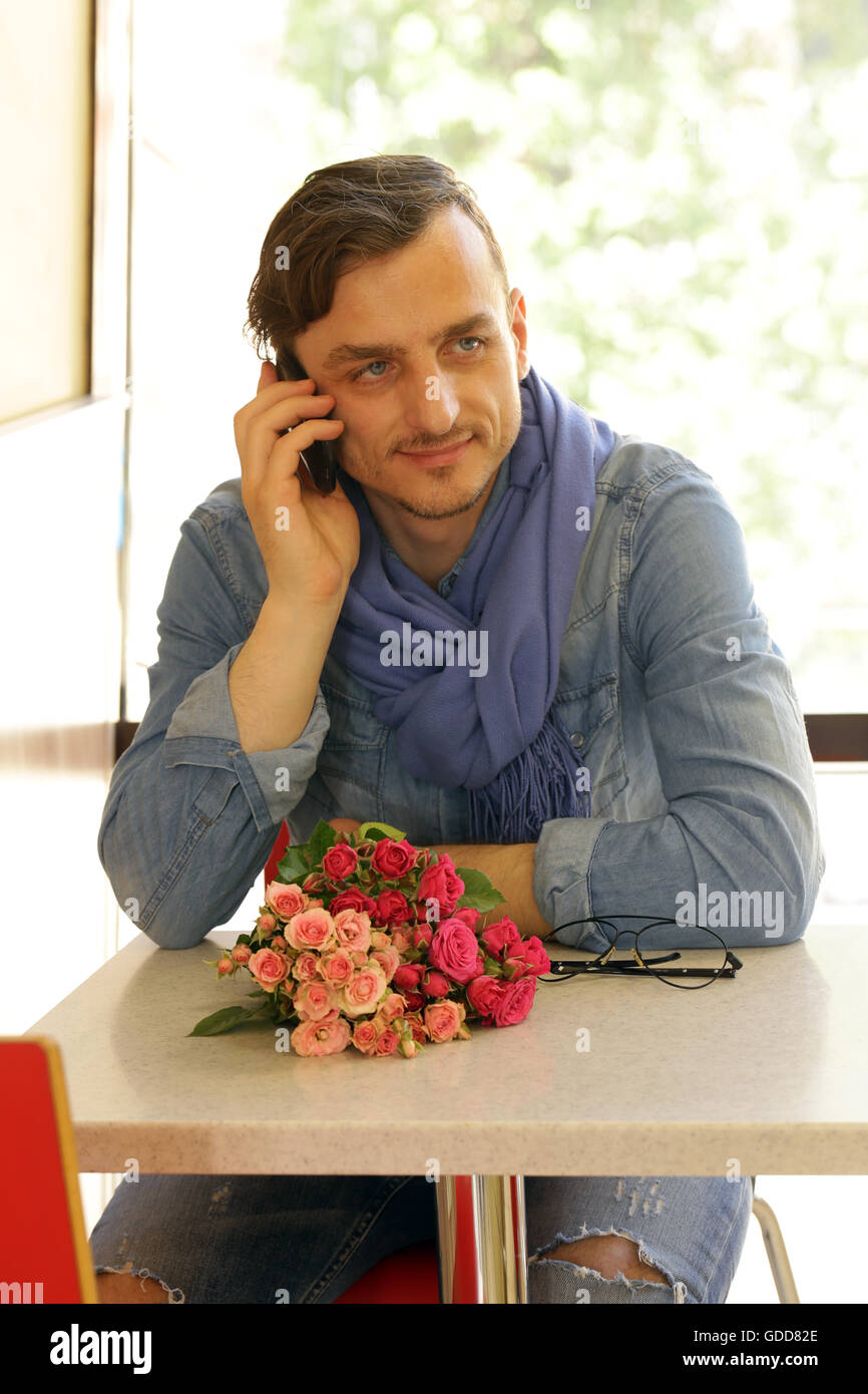 Man holding a bouquet of roses hi-res stock photography and images - Alamy