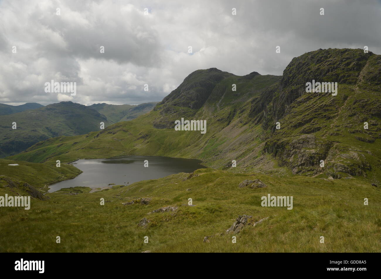 Stickle Tarn below The Langdale Pikes in The English Lake District Stock Photo