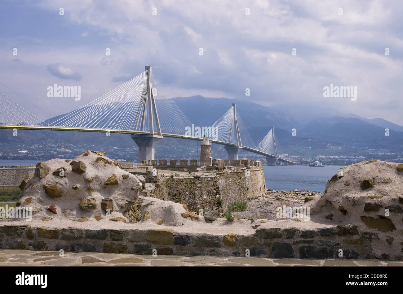 Old castle versus modern cable bridge in Greece Stock Photo