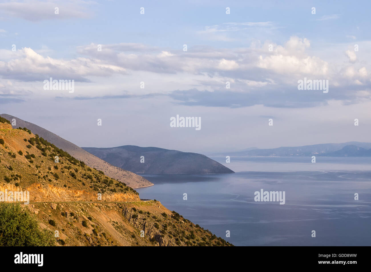 Amazing view from the top of a mountain down to the sea, close to Itea, Greece, at dusk Stock Photo