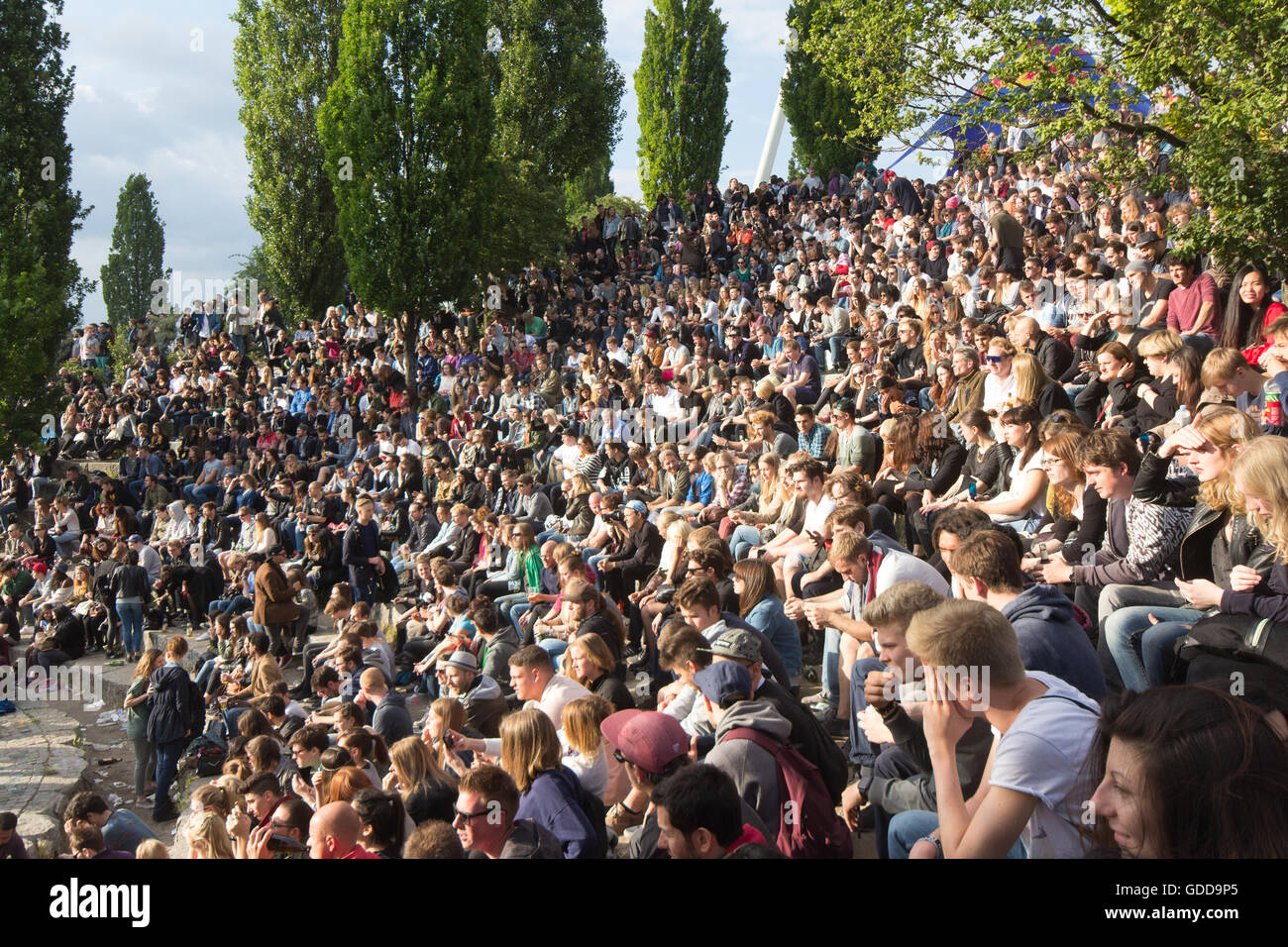 Many people in crowded park (Mauerpark) at 'fete de la musique'  in Berlin, Germany. Stock Photo