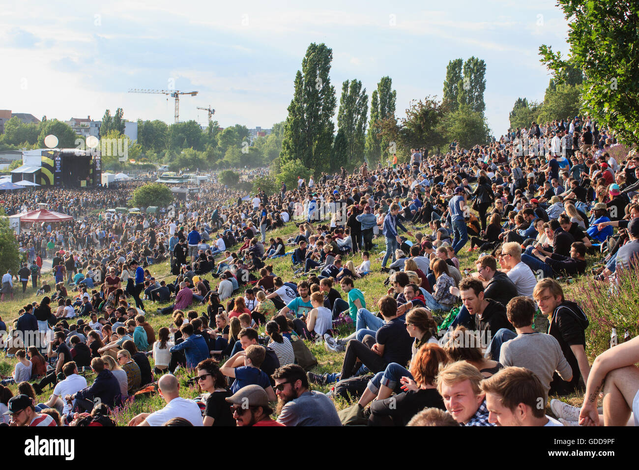 Many people in crowded park (Mauerpark) at 'fete de la musique'  in Berlin, Germany. Stock Photo