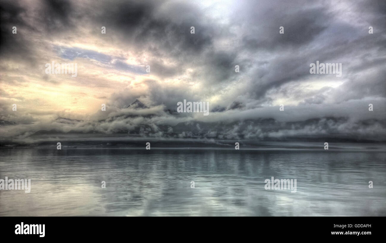 Valdez,Alaska,USA,sea,fog,gray,water,clouds,fog patches,rains,bad weather,Mystical,mood,mountains,lights, Stock Photo