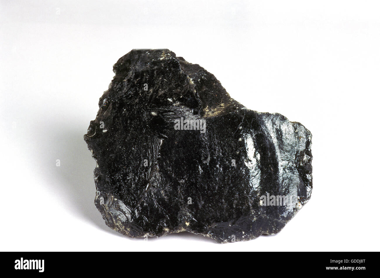 Black Obsidian Stone against White Background Stock Photo