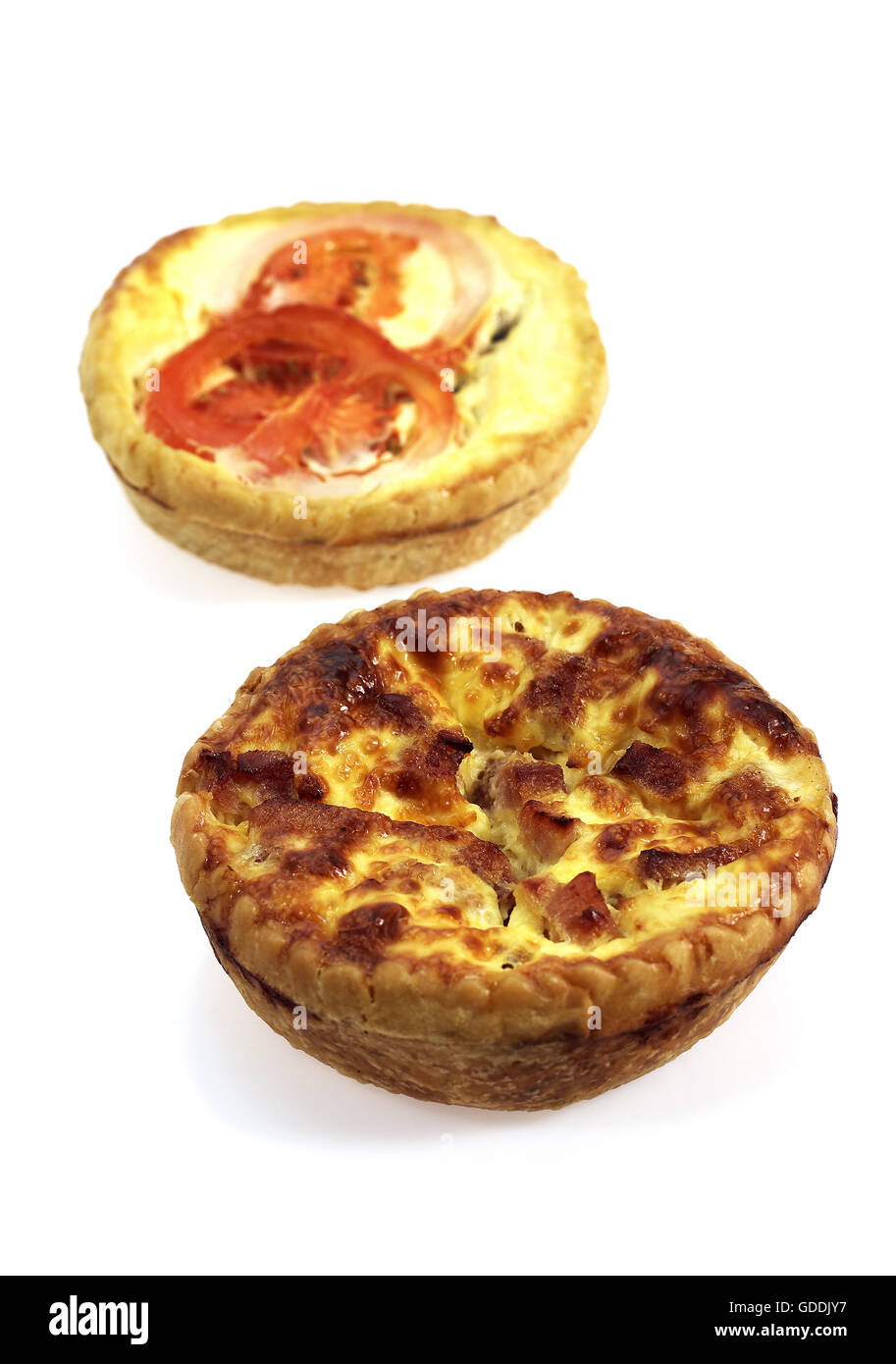 Leek Quiche and Tuna Quiche with Tomatoe against White Background Stock Photo