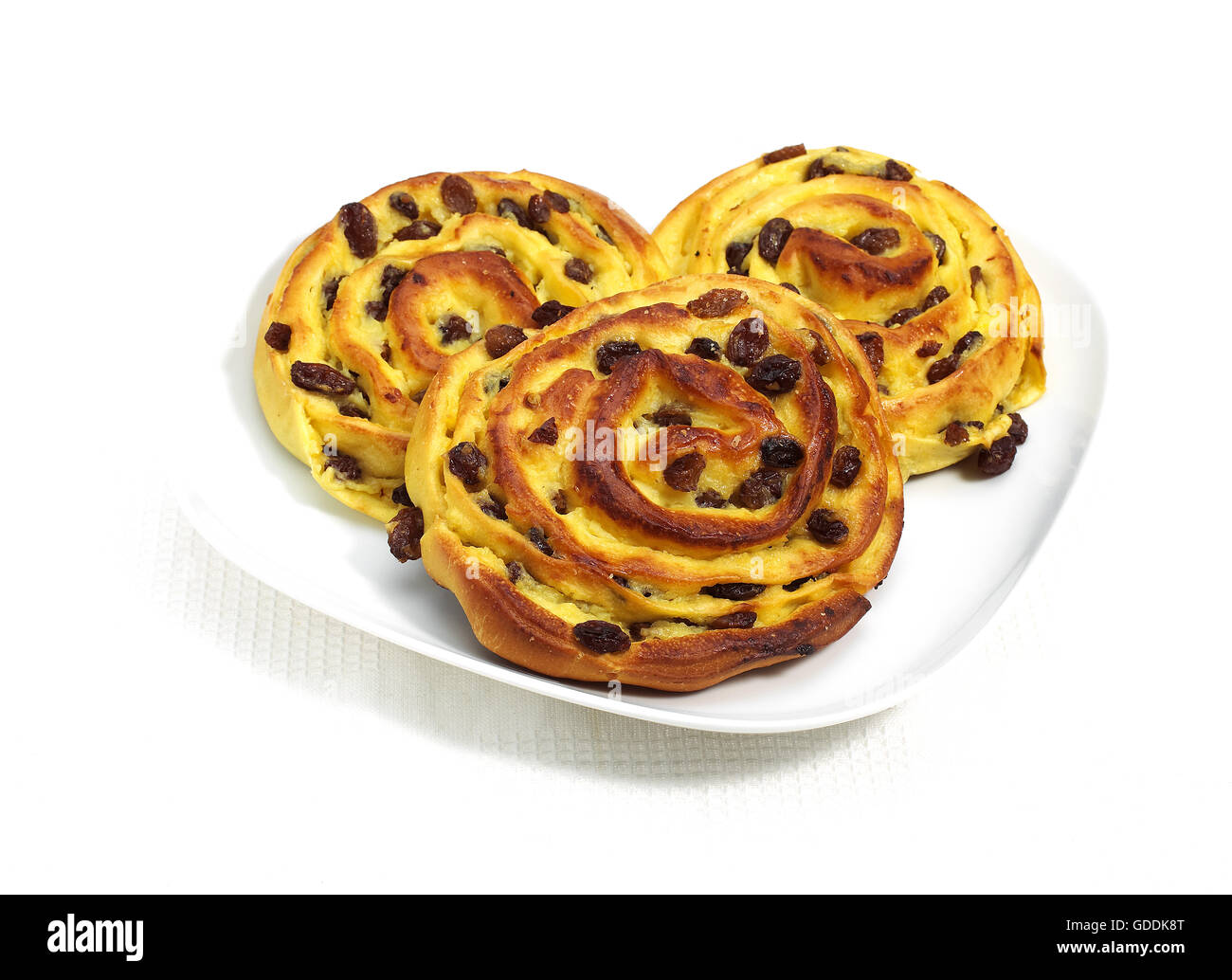 DANISH PASTRY WITH RAISINS AGAINST WHITE BACKGROUND Stock Photo