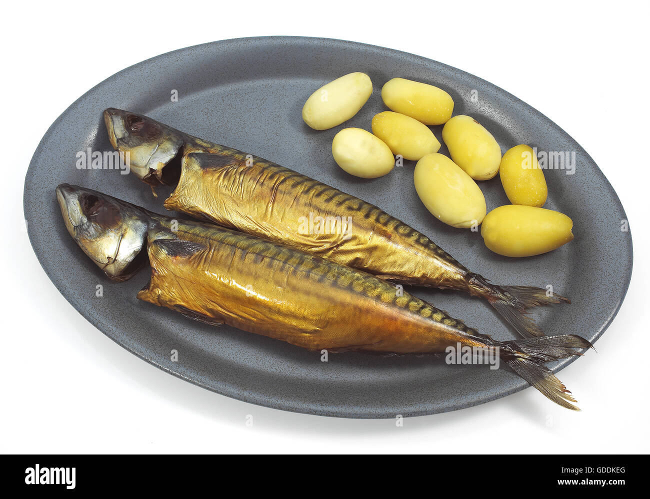 SMOKED MACKERL scomber scombrus WITH POTATOES ON A PLATE Stock Photo