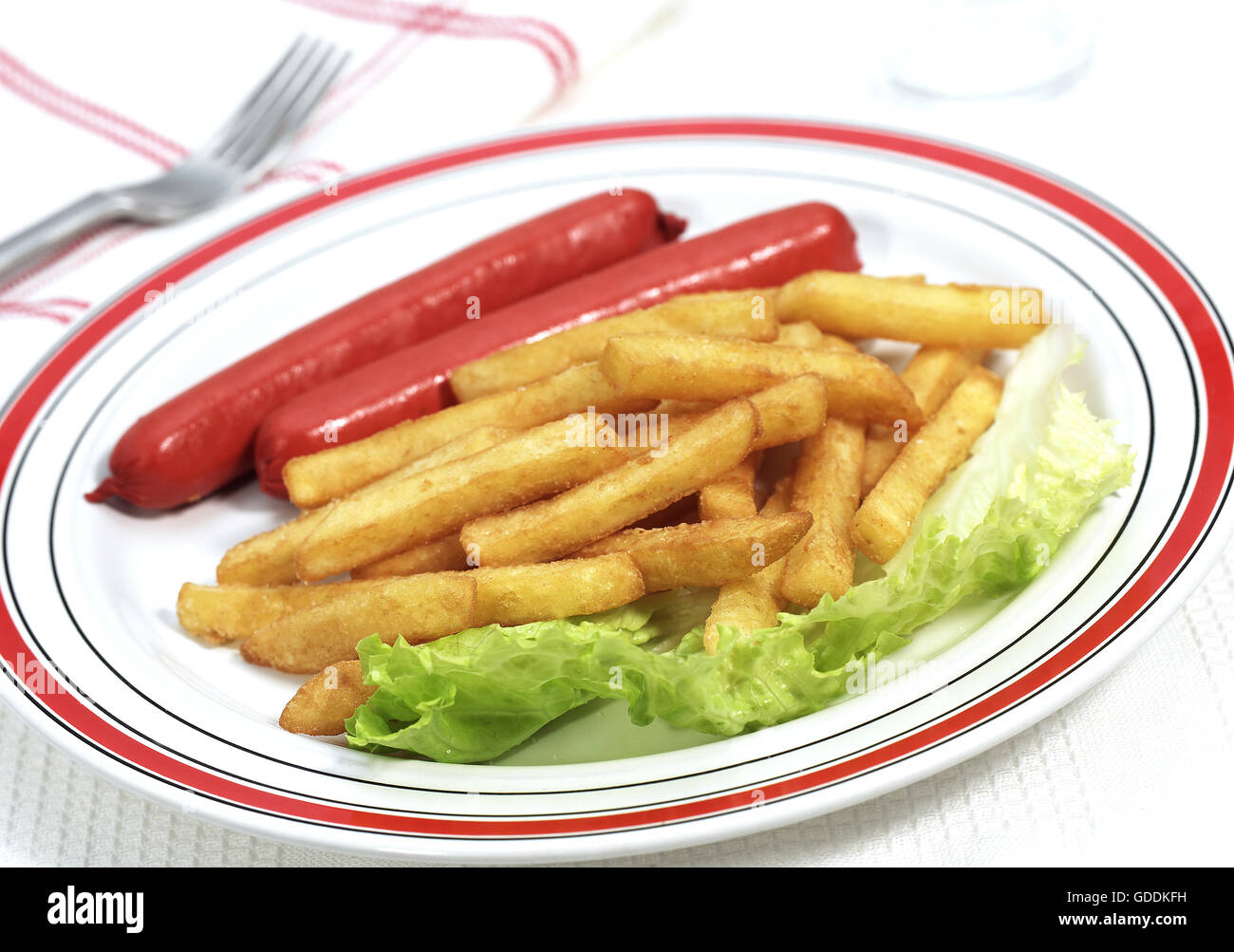 Plate with Sausage and French Fries Stock Photo
