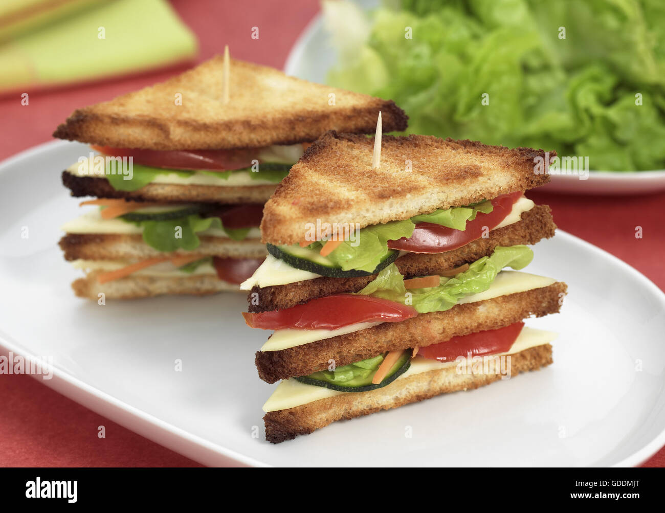 FAST FOOD, CLUB SANDWICH WITH SALAD AND TOMATO Stock Photo