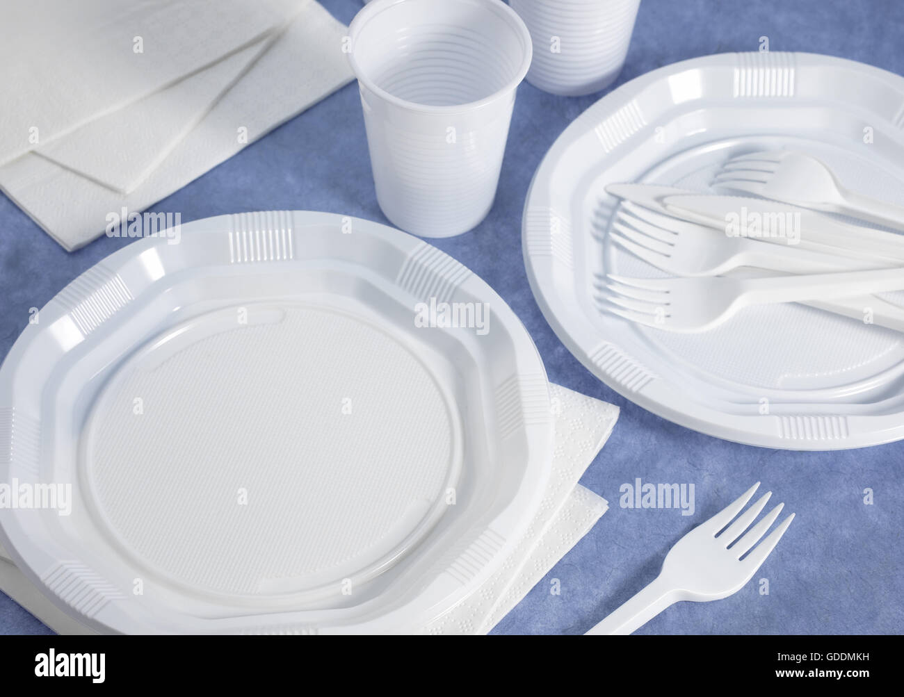 PLASTIC PLACE SETTING AND PAPER NAPKIN Stock Photo