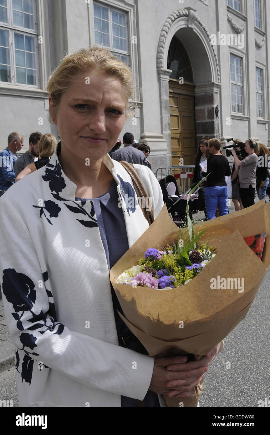 Copenhagen, Denmark. 15th July, 2016.Ms.Zania Stampe danish female politician fromdanish radical libery party pays tribute to French victims laying flowers at French Embassy in Copenhagen Denmark among other dane pat ribune to france and french flag is at half mast at French Embassy due o nice victims on french national day bestal day in Nice . Credit:  Francis Joseph Dean/Dean Pictures/Alamy Live News Stock Photo