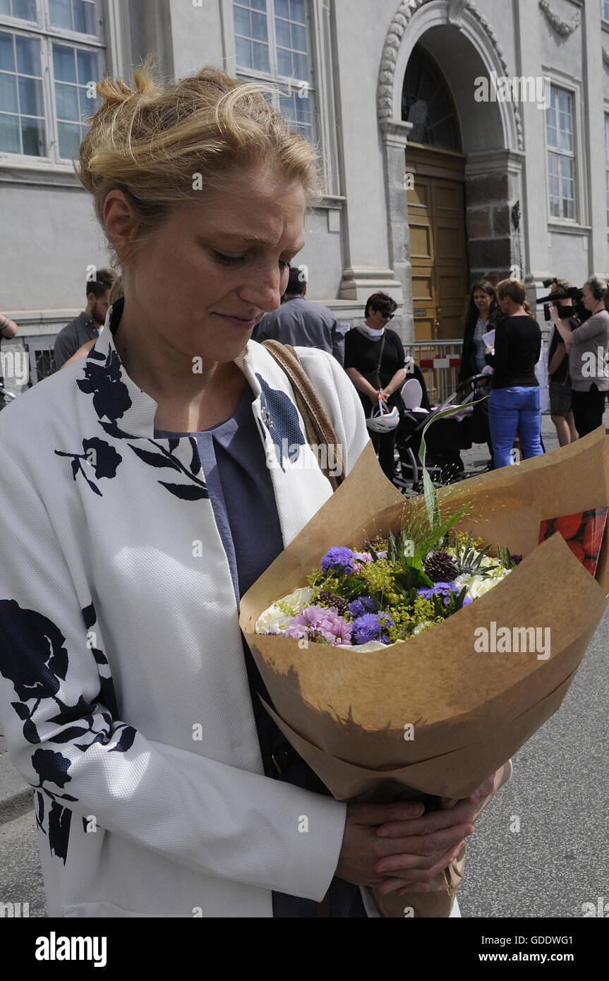 Copenhagen, Denmark. 15th July, 2016.Ms.Zania Stampe danish female politician fromdanish radical libery party pays tribute to French victims laying flowers at French Embassy in Copenhagen Denmark among other dane pat ribune to france and french flag is at half mast at French Embassy due o nice victims on french national day bestal day in Nice . Credit:  Francis Joseph Dean/Dean Pictures/Alamy Live News Stock Photo