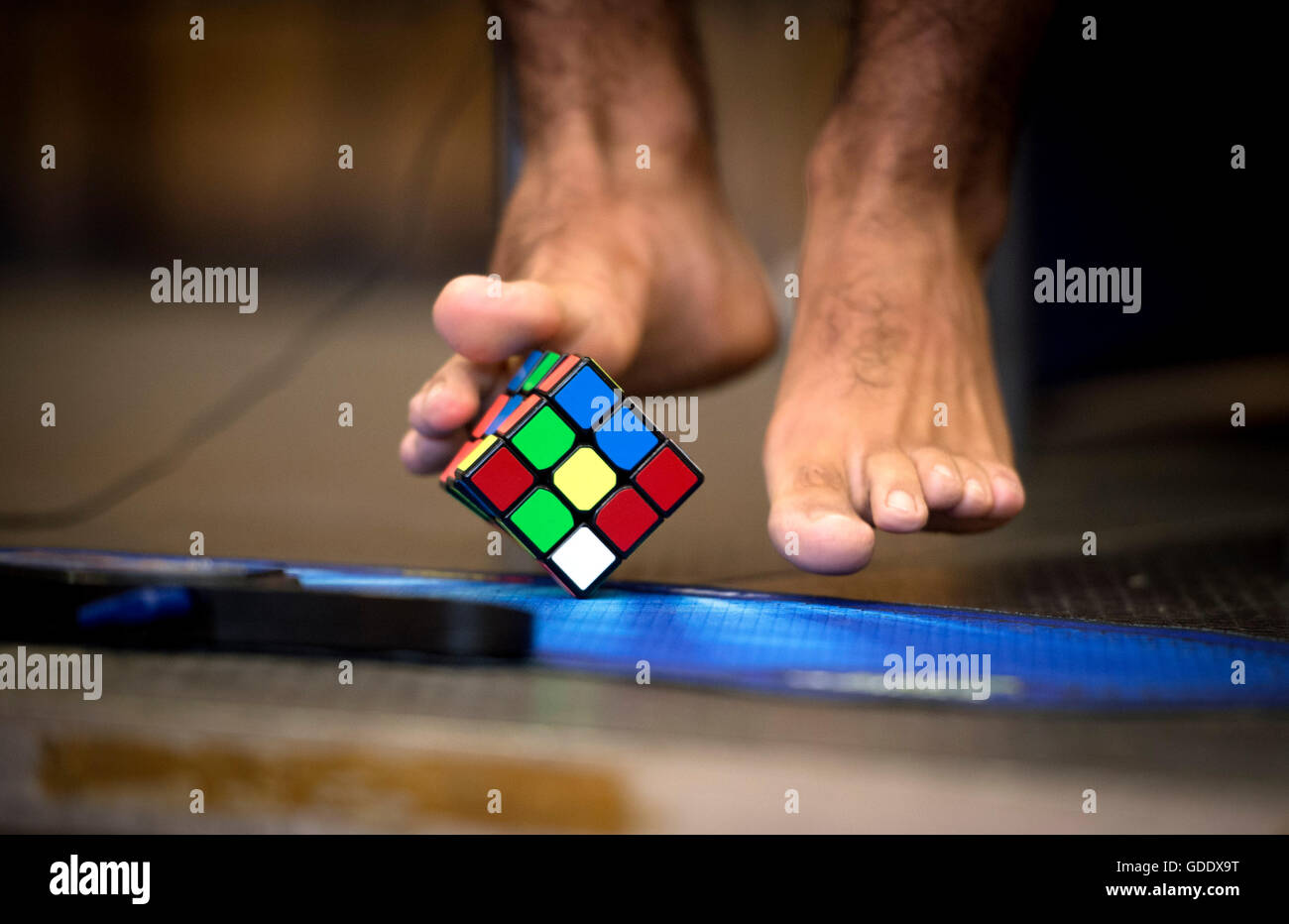 Prague, Czech Republic. 15th July, 2016. Player solves a Rubik's cube with his feet during the Rubik´s cube European Championship 2016 in Prague, Czech Republic, July 15, 2016. Credit:  Katerina Sulova/CTK Photo/Alamy Live News Stock Photo