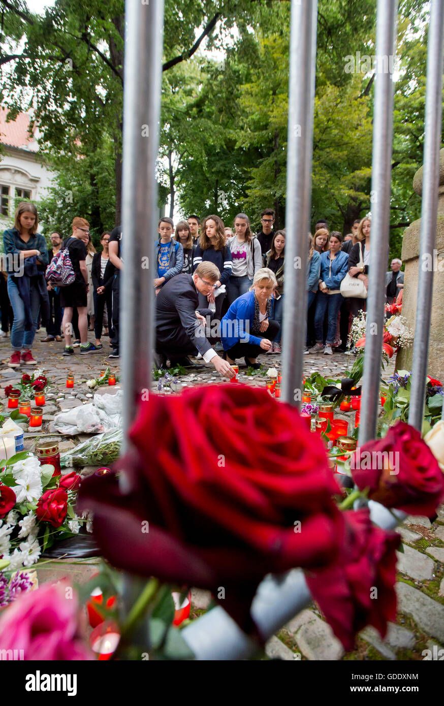 Prague, Czech Republic. 15th July, 2016. Czech people light candles and lay flowers outside the French Embassy in Prague in tribute for the victims of the Nice attacks, in Prague, Czech Republic, 15 July 2016. According to reports, more than 80 people died and many were wounded. Credit:  Vit Simanek/CTK Photo/Alamy Live News Stock Photo