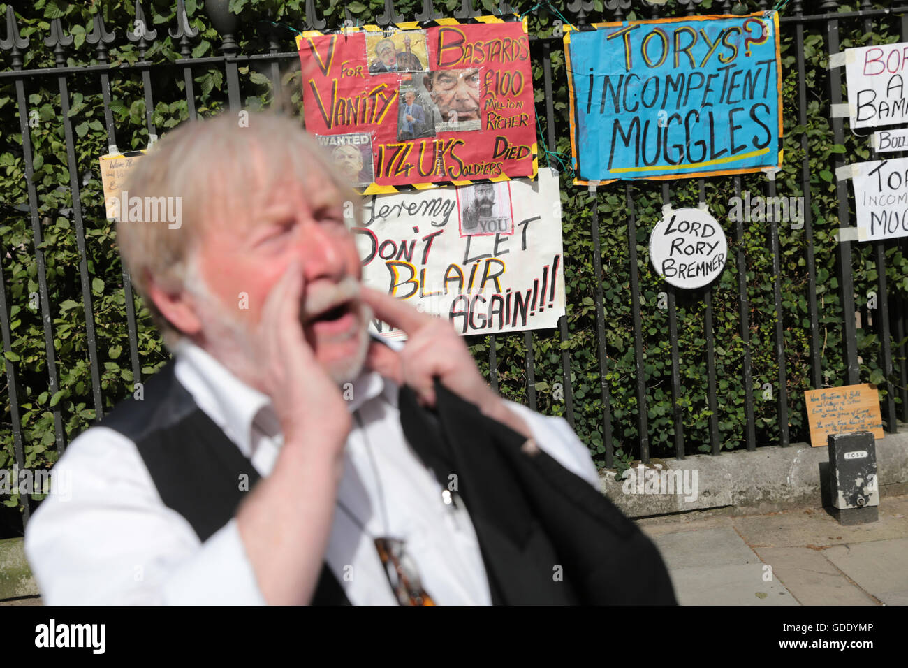 London, UK. 15th July, 2016. Anti-Government protester, Harry McEchan, aka, Echan O'Fechan, protestc outside Russel Square.  His  posters display anti-government sentiments, messages, slogans and sartirical images critisising the current government, leadership of Labour and Conservatives, Cabinet reshuffle, new positions and issues over Brexit and the Chilcott enquiry. Credit:  David Stock/Alamy Live News Stock Photo
