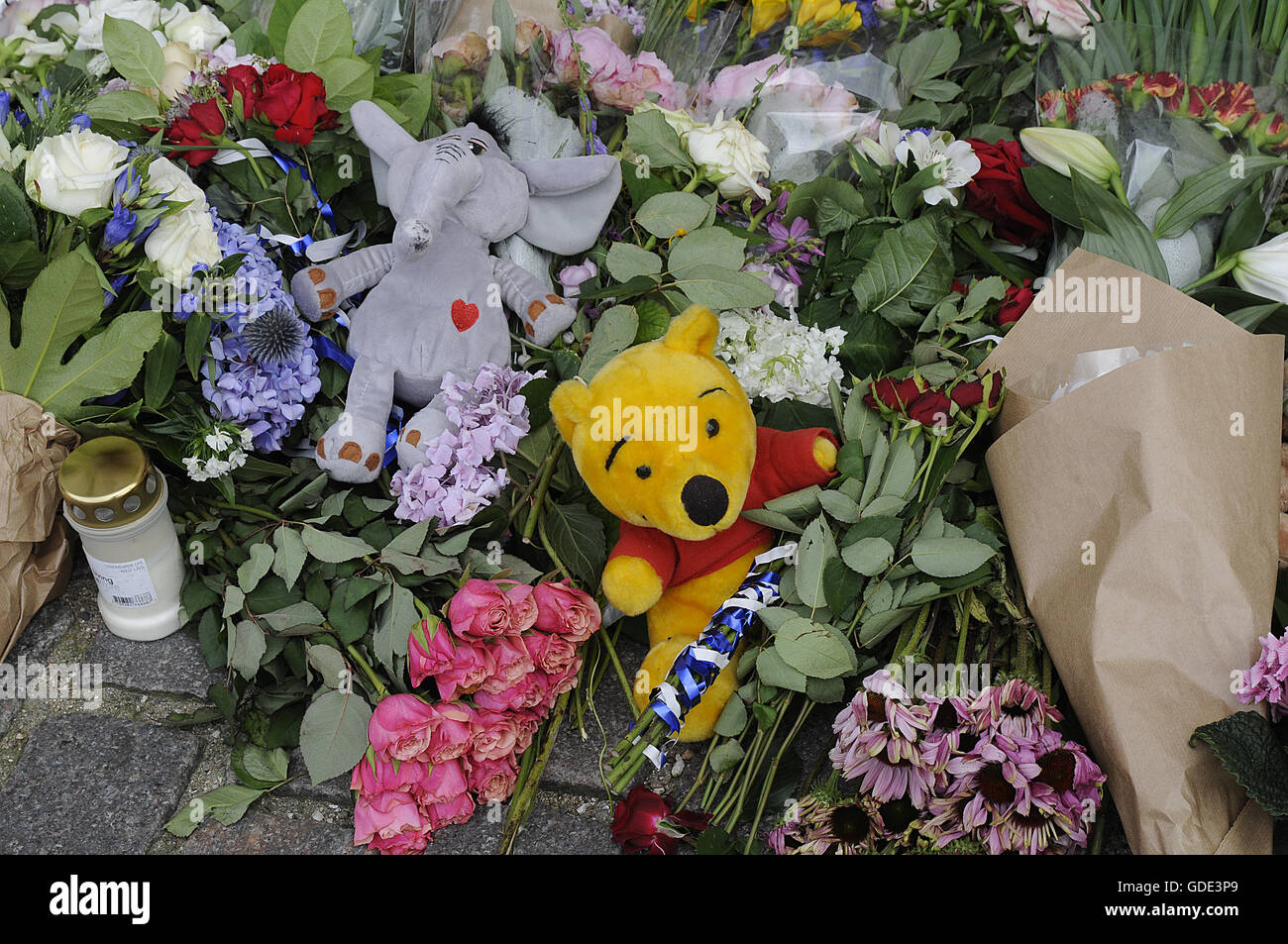 Copenhagen, Denmark. 16th July, 2016.-European union and French flags at half mast at french embassy and people are puring with flowers to pay tribute and stand solidatry with Frnech victims dies in terrorist attacked in Nice France on French national day on july 14, 2016 Credit:  Francis Joseph Dean/Dean Pictures/Alamy Live News Stock Photo