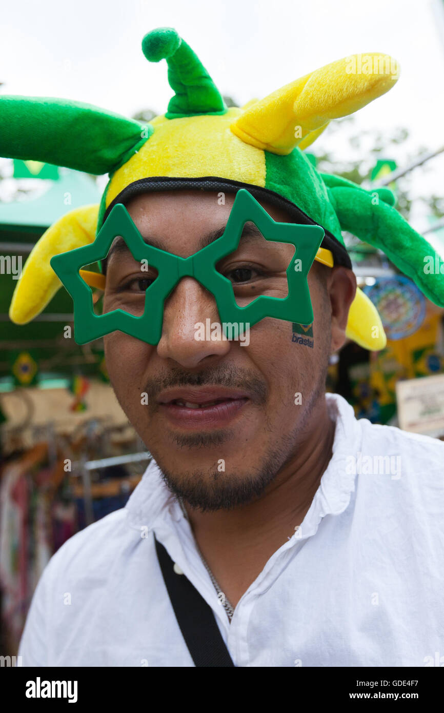 Tokyo, Japan. 16th July, 2016. A man enjoys the Festival Brasil 2016 at Yoyogi Park on July 16, 2016, Tokyo, Japan. The annual festival brings together Brazilian food and entertainment including Samba and Capoeira performers. Organized by the Camara de Comercio Brasileira no Japao the event runs until July 17. The Brazilian community is the third largest immigrant population in Japan. Credit:  Rodrigo Reyes Marin/AFLO/Alamy Live News Stock Photo
