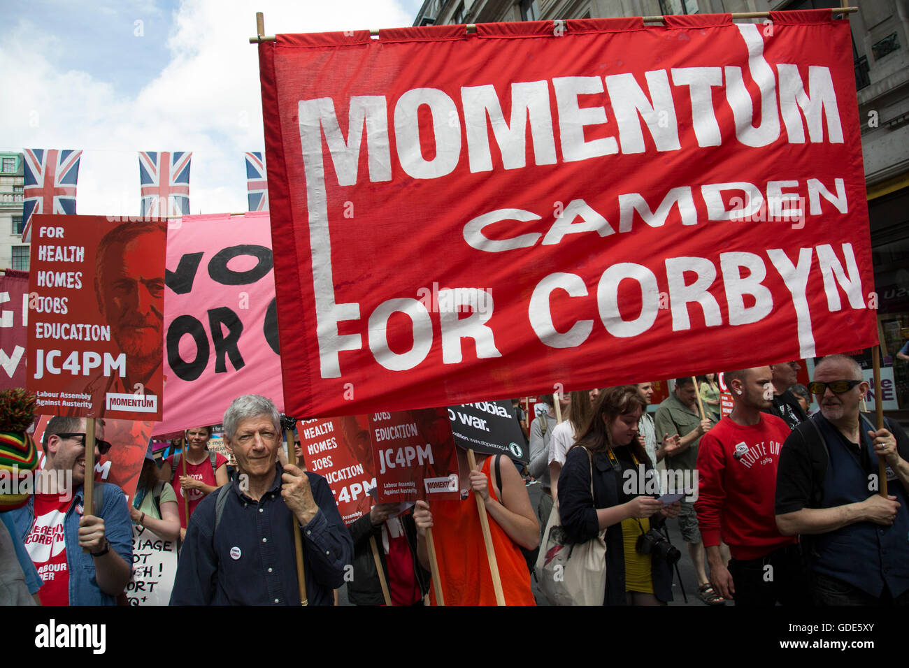 London, UK. 16th July, 2016. Pro Jeremy Corbyn placards at the Peoples Assembly demonstration: No More Austerity - No To Racism - Tories Must Go, on Saturday July 16th in London, United Kingdom. Tens of thousands of people gathered to protest in a march through the capital protesting against the Conservative Party cuts. Almost 150 Councillors from across the country have signed a letter criticising the Government for funding cuts and and will be joining those marching in London. Credit:  Michael Kemp/Alamy Live News Stock Photo