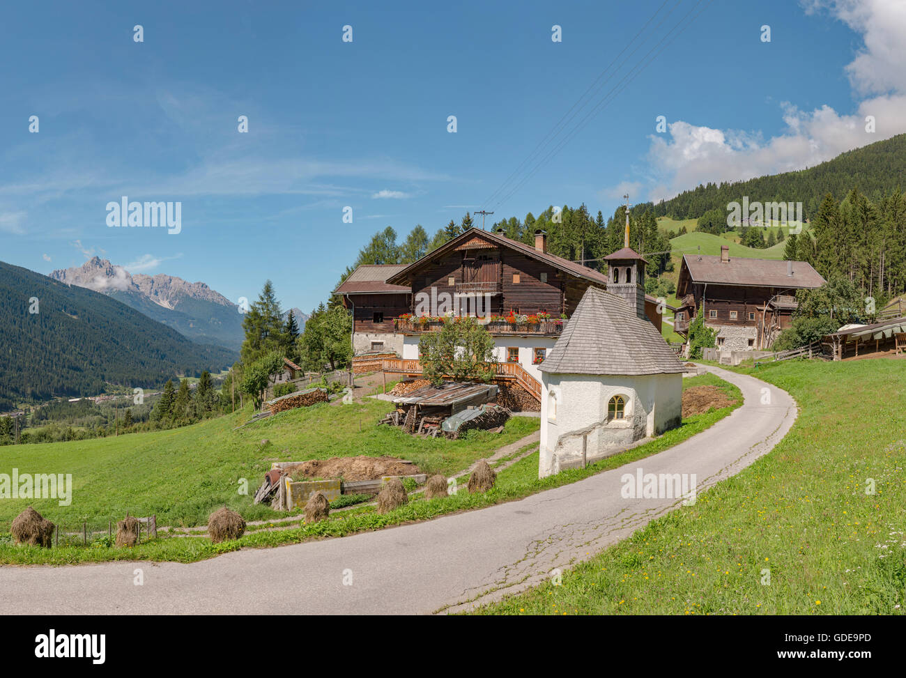 Sillian,Austria,Farmhouse and chapel at mountain Sillianberg Stock Photo