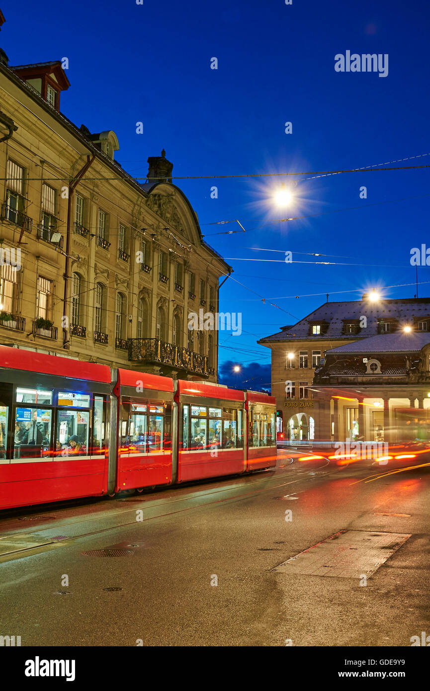 Bern,town,city,Switzerland,Europe,lights,traffic,dusk,twilight,blue hour,cars,automobiles,tram,streetcar,real esta Stock Photo