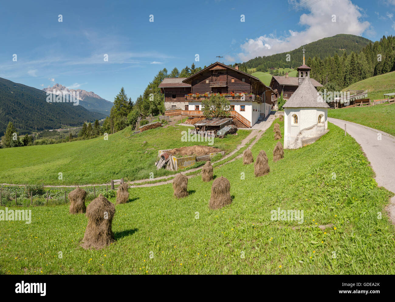 Sillian,Austria,Farmhouse and chapel at mountain Sillianberg Stock Photo