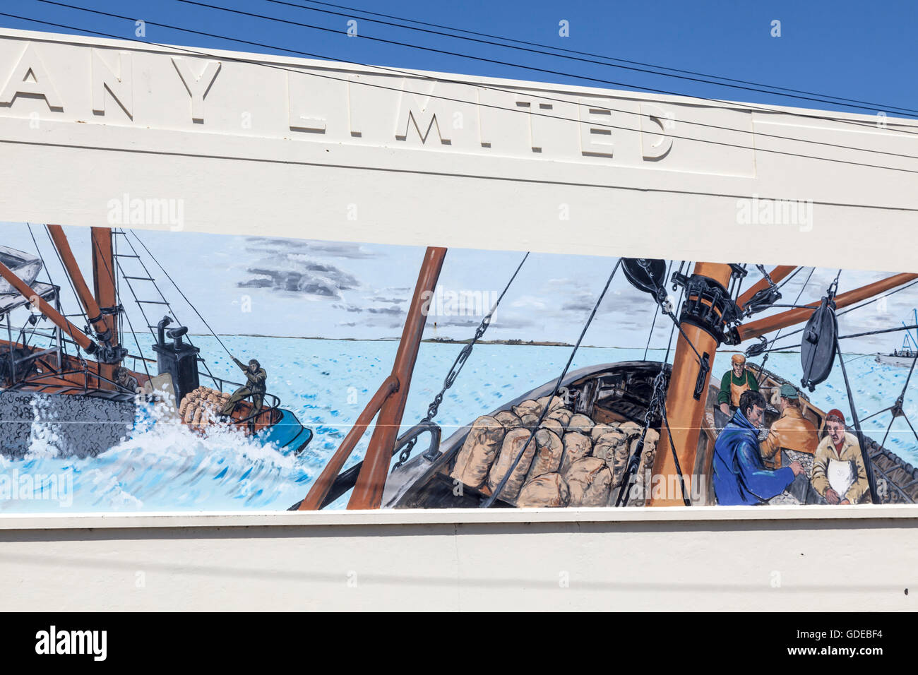 Mural on the exterior of the New Zealand Shipping Company warehouse, Bluff, New Zealand Stock