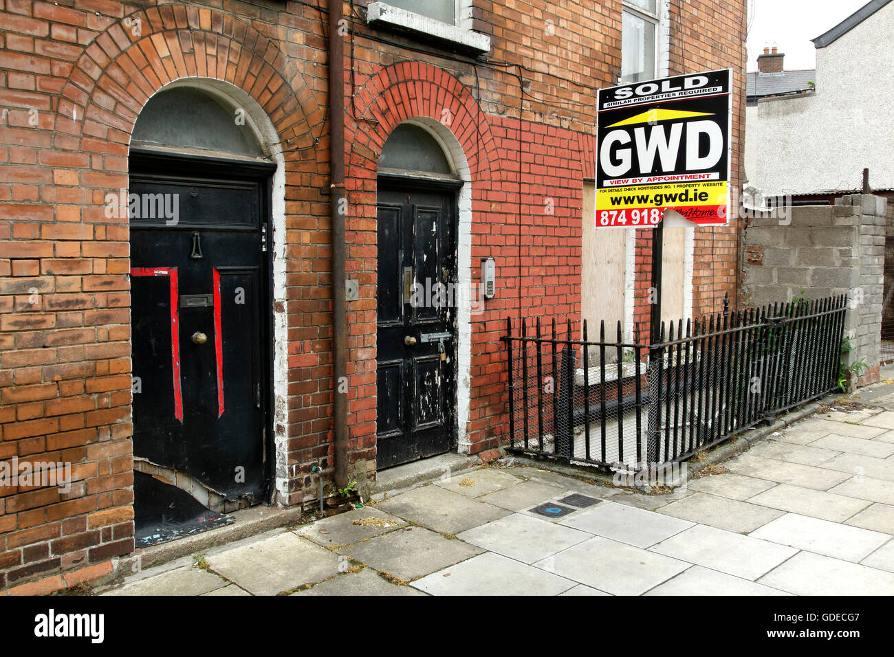 Real estate sign outside of red brick building, Dublin, Republic of