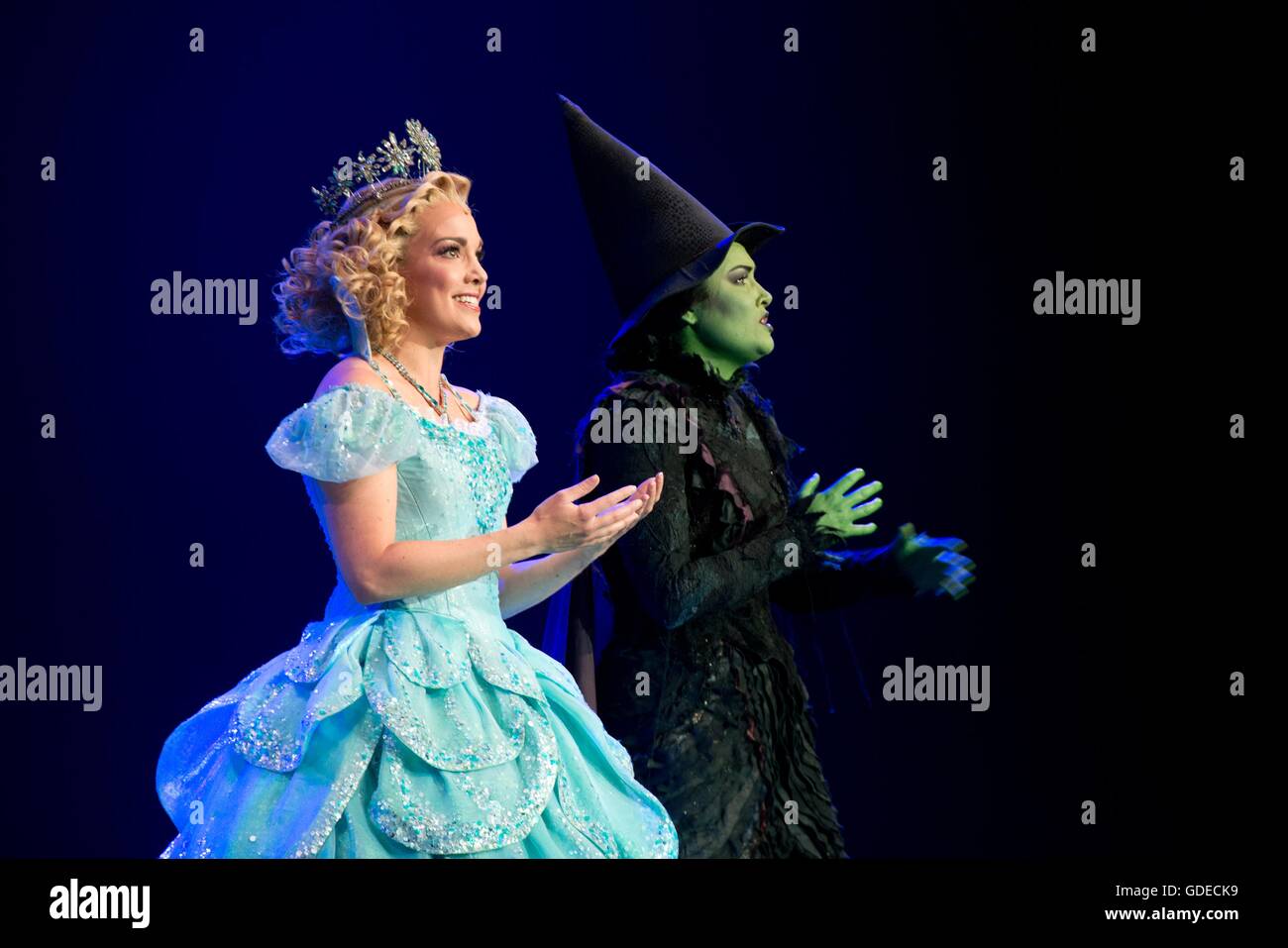 The good witch and wicked witch from the Broadway musical Wicked performs for U.S President Barack Obama and German Chancellor Angela Merkel during the opening ceremony for the USA Pavilion at the Hannover Messe Trade Fair April 25, 2016 in Hannover, Germany. The event is the world's largest industrial technology trade fair held yearly since 1947 in northern Germany. Stock Photo