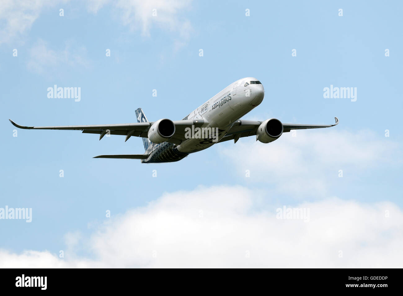 An Airbus A350 flies during the Farnborough International Airshow in July 2016 Stock Photo