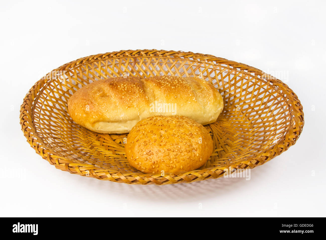 whole wheat bread and bun on a wicker plate Stock Photo - Alamy