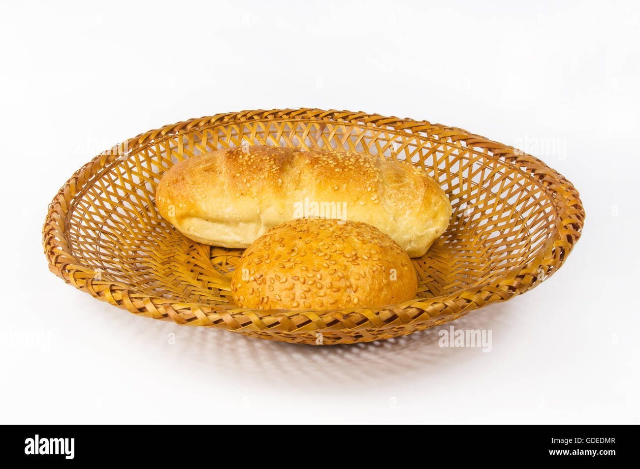 whole wheat bread and bun on a wicker plate Stock Photo - Alamy
