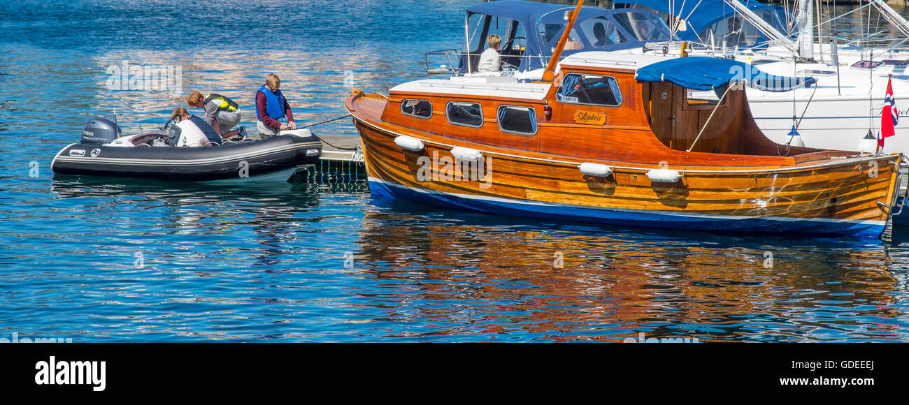 Colorful Old Wooden boat moored in Brosundet Canal. Alesund, Norway, More og Romsda, Scandinavia, European Stock Photo