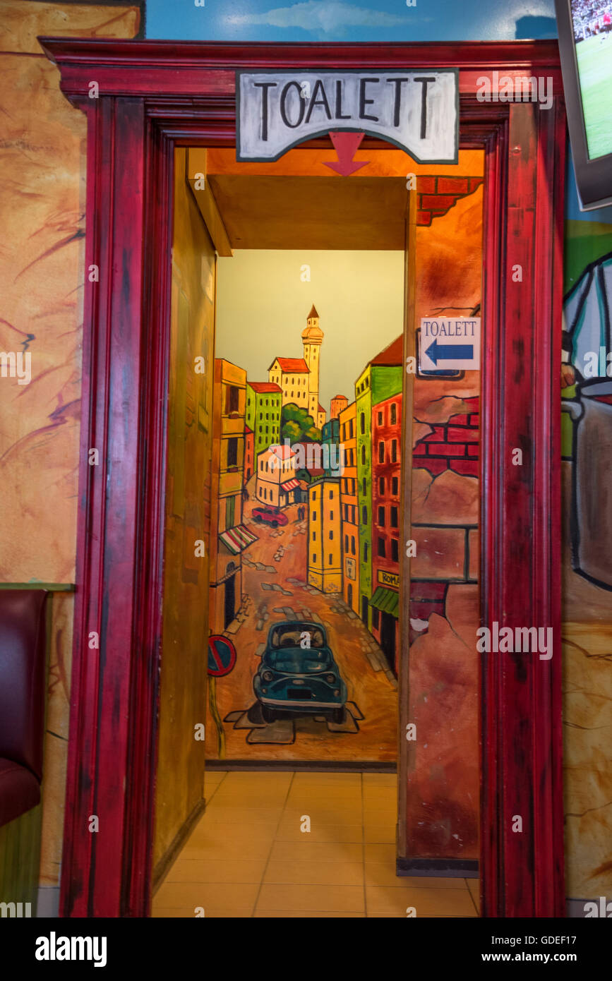 Bathrooms,Toilets,Toaletts, colorful toilet entrance to bathroom in restaurant. Europe, European, Scandinavia Stock Photo