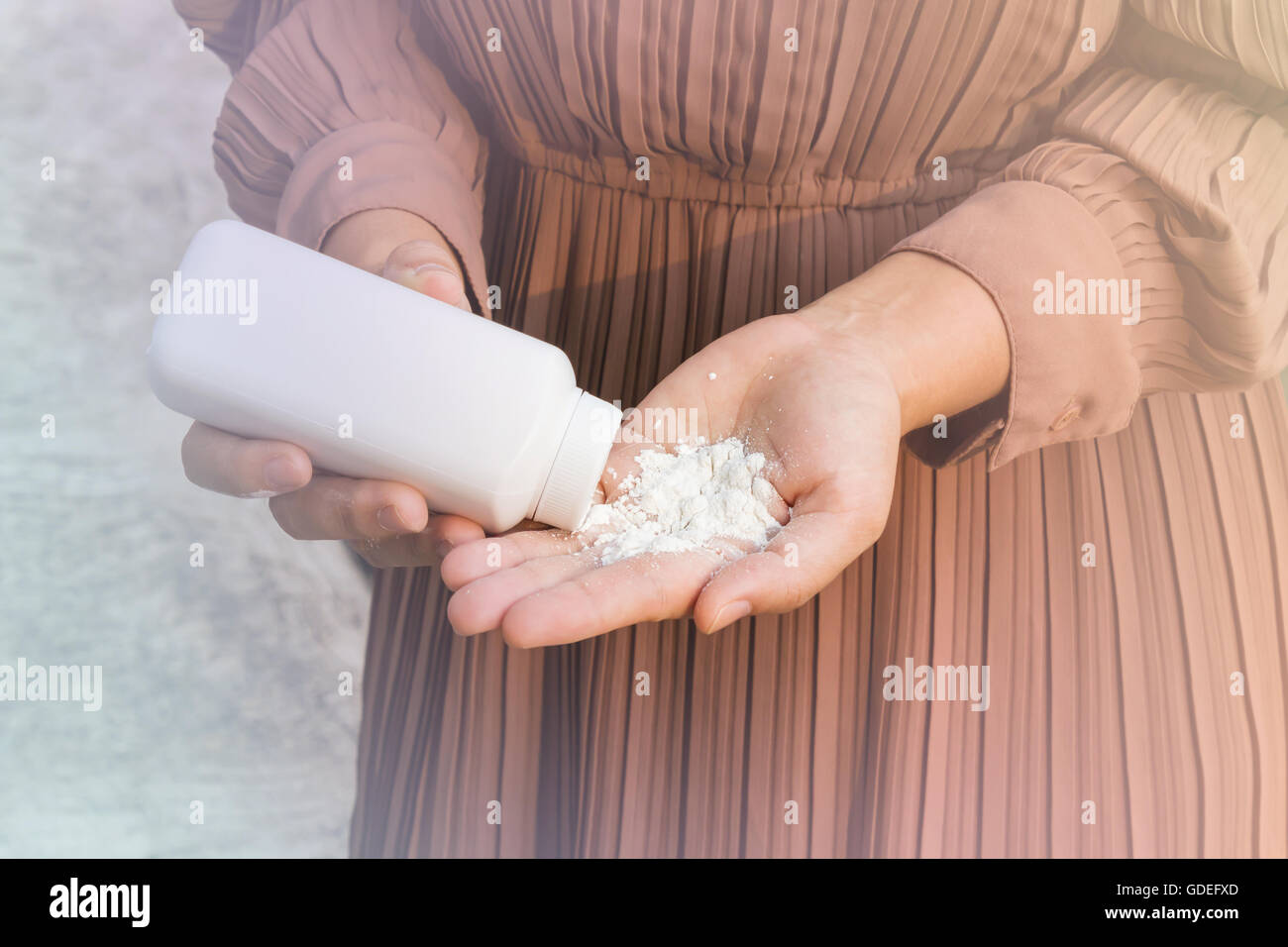 Women hand apply talcum powder Stock Photo Alamy