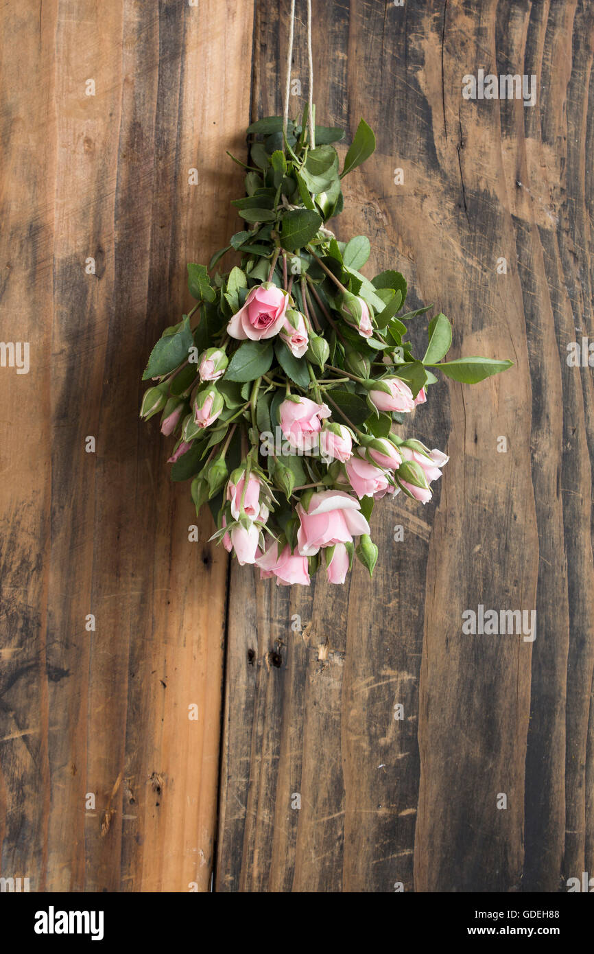 Rustic Roses With Pip Bouquet of Pink Roses on a Rustic Background of a Board Stock Photo - Alamy