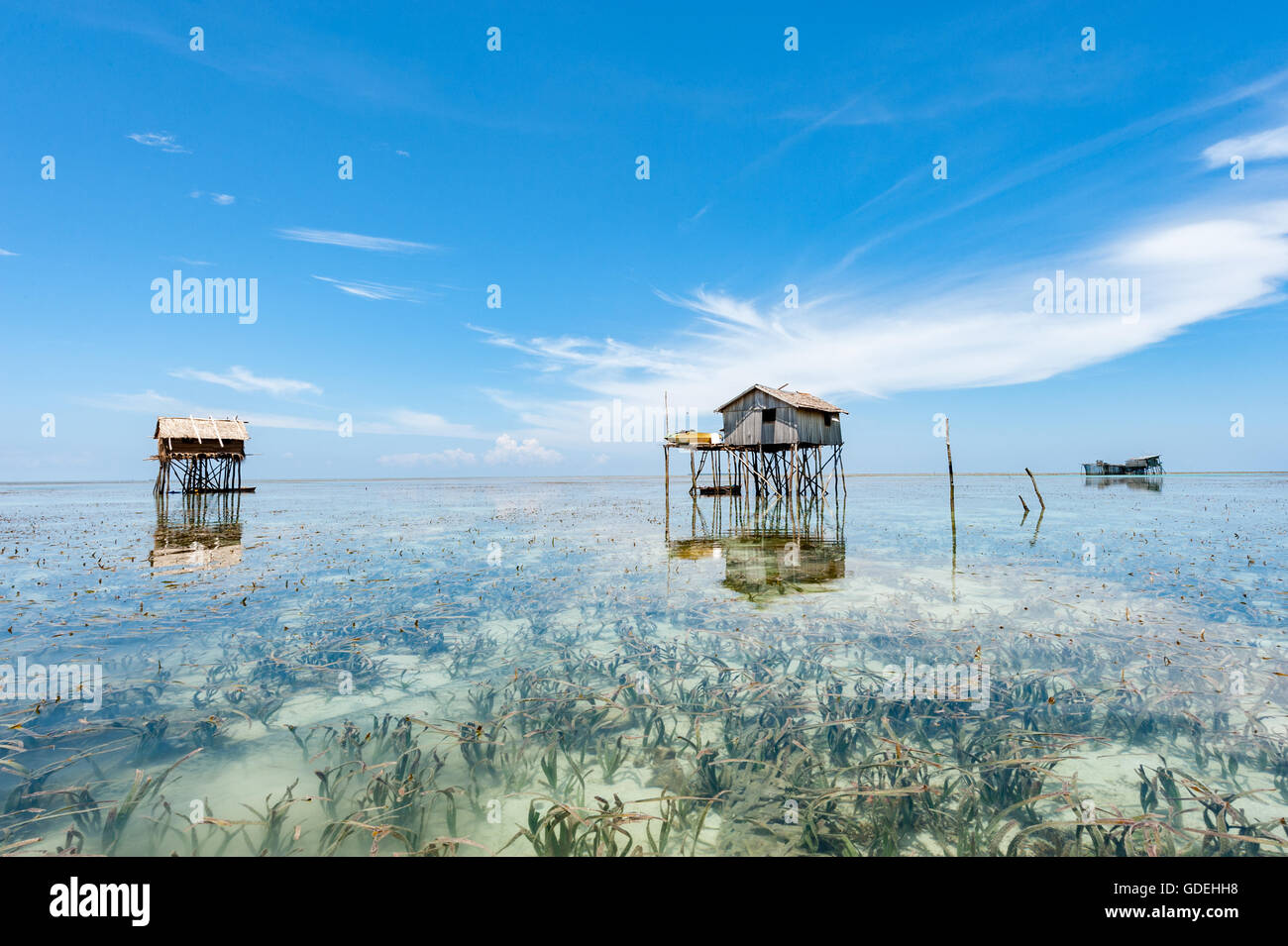 Wooden huts on stilts in ocean, Semporna, Sabah, Malaysia Stock Photo