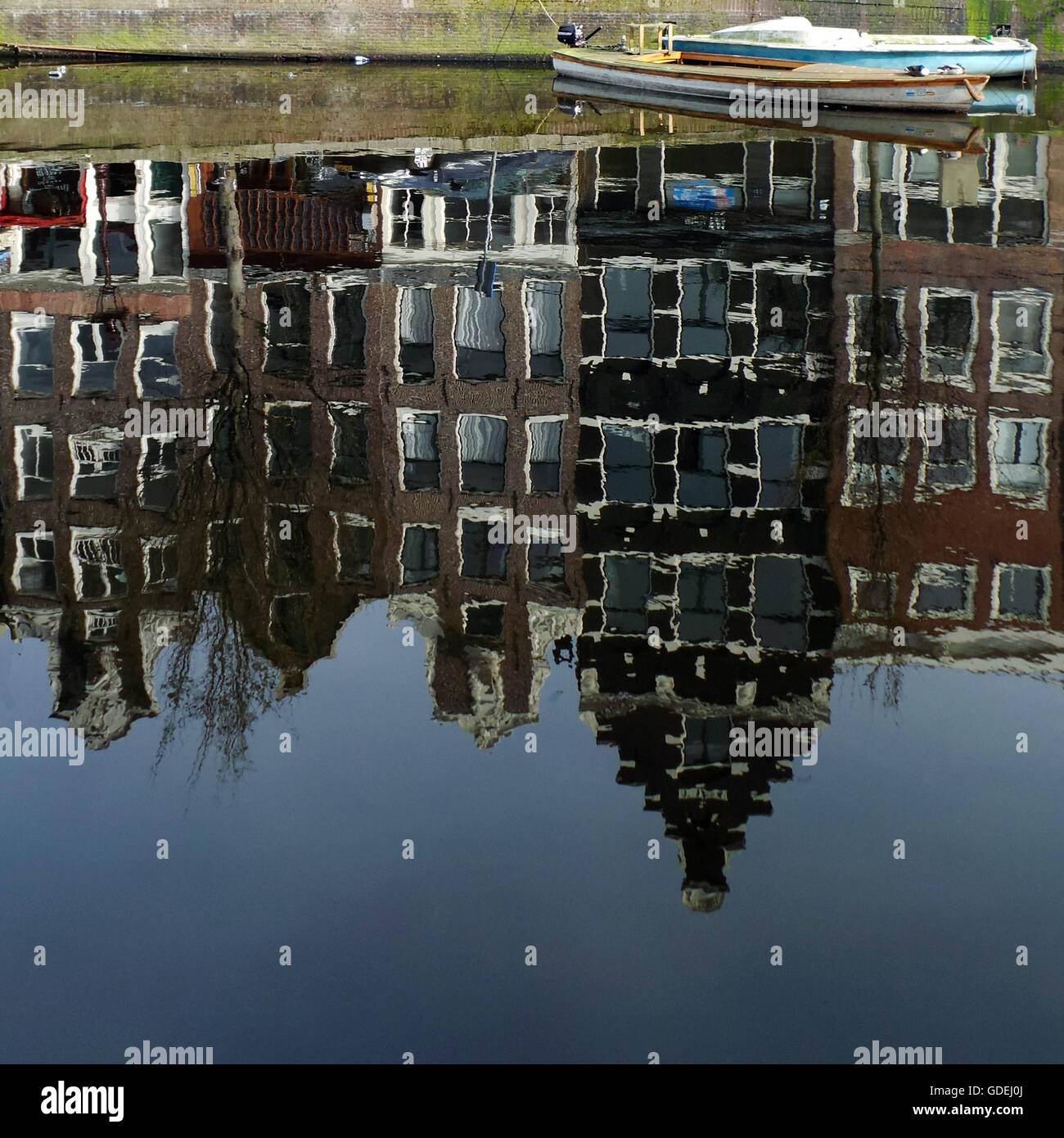 Reflections of buildings along canal, Amsterdam, Holland Stock Photo