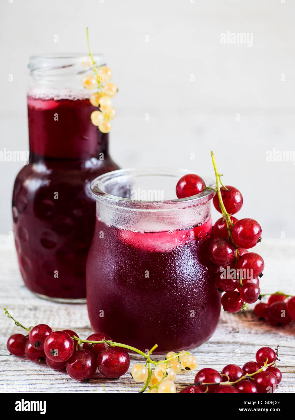 bottle and Glass of iced Hibiscus Tea Stock Photo