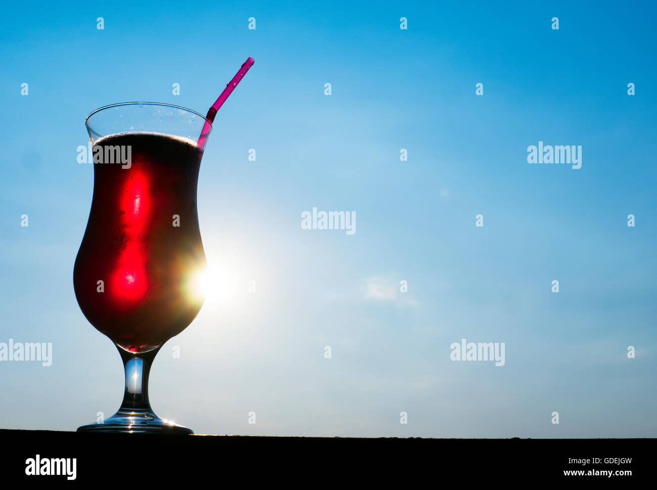 red drink against blue sky Stock Photo