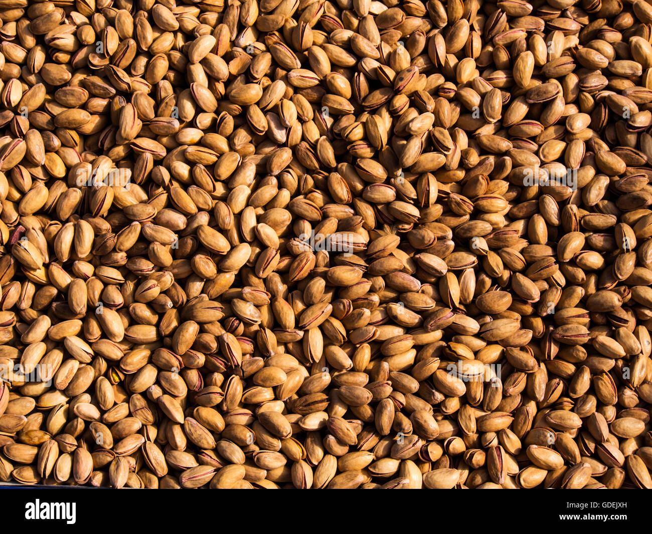 Close-up of salted pistachios in market Stock Photo