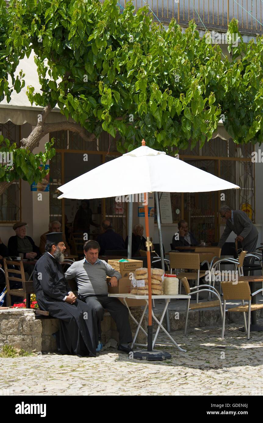 Monk sitting in a Street Cafe, Troodos Mountains, Republic of Cyprus Stock Photo