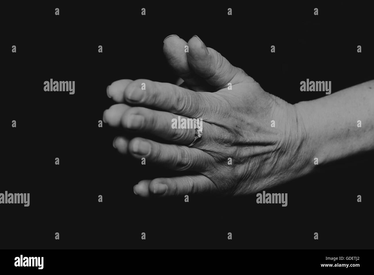 Beautiful hands on black Black and White Stock Photos & Images - Alamy