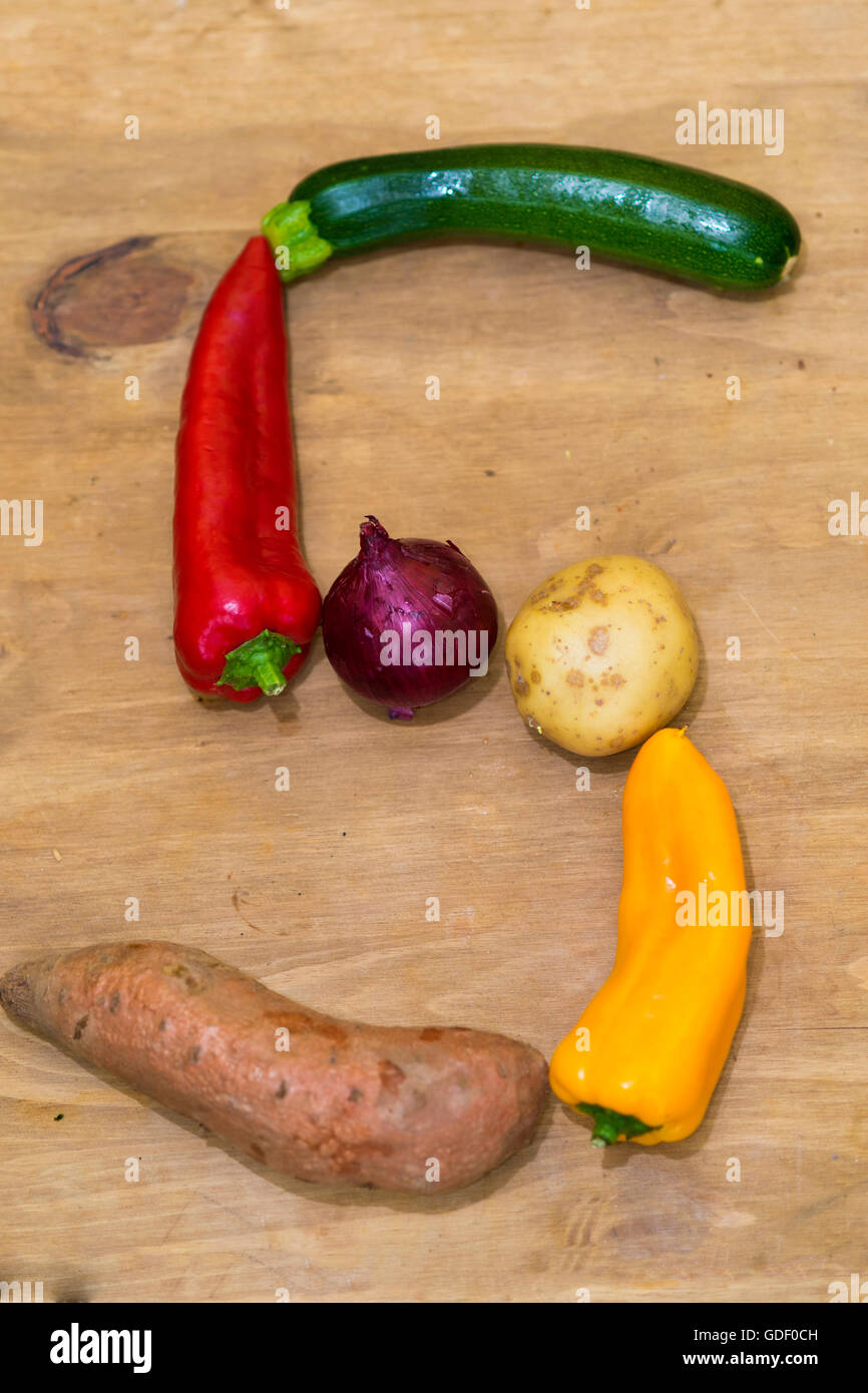 Colourful mixed vegetables in the shape of a number 5 symbolising five a day Stock Photo