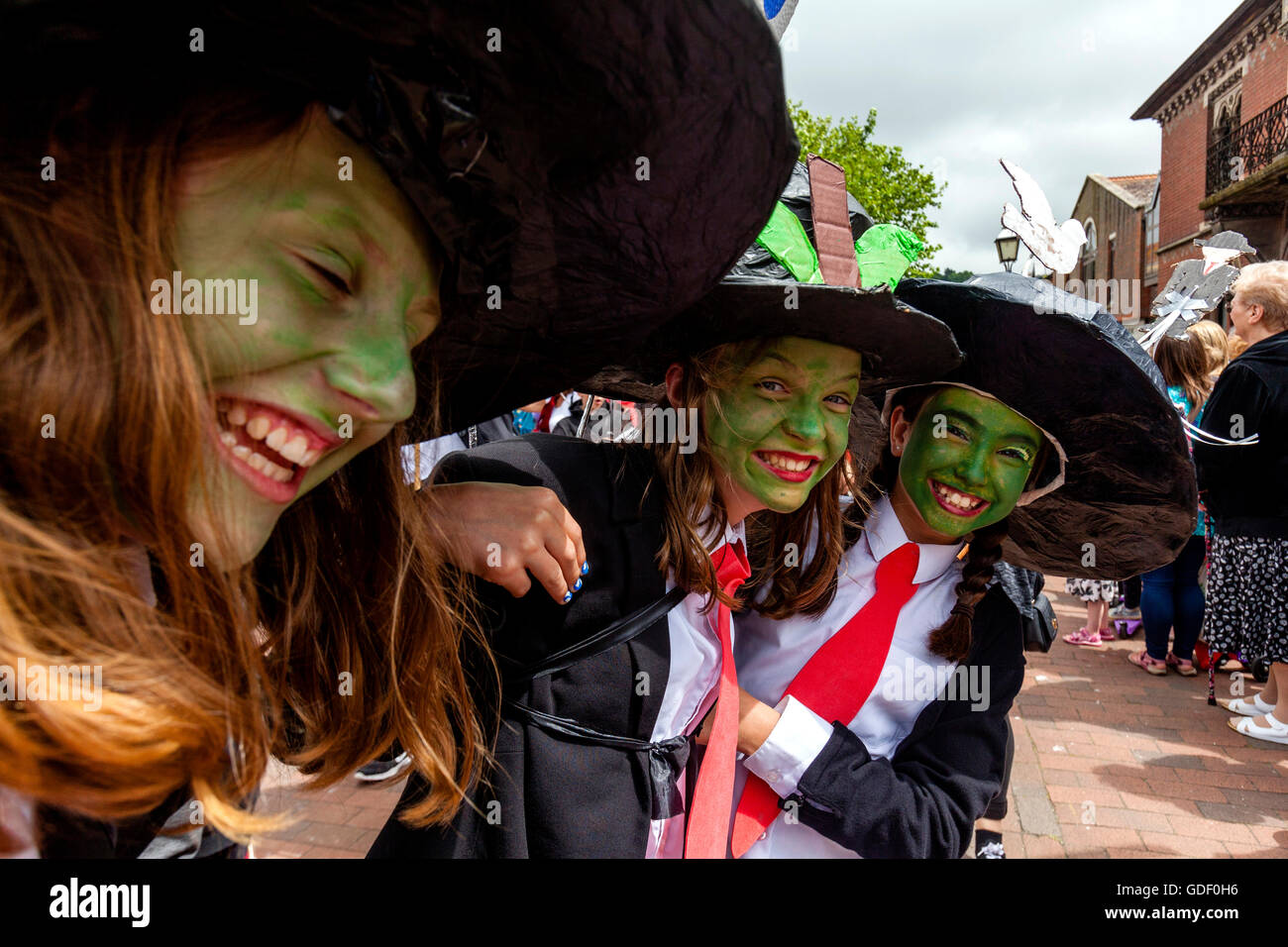 Two Girls In Costume Pose For A Photo During The Annual Lewes Schools 'Moving On' Parade, High Street, Lewes, East Sussex, UK Stock Photo