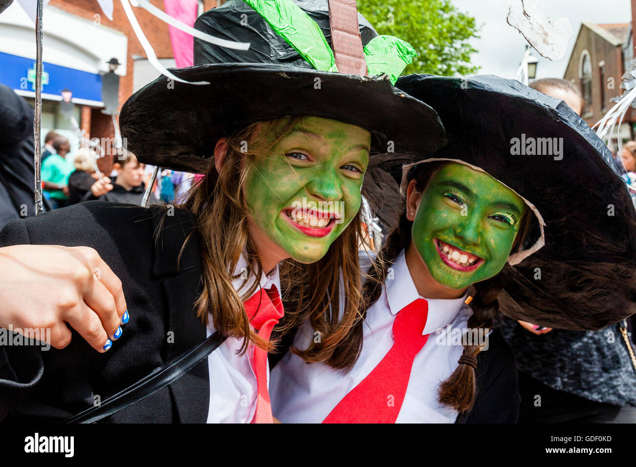 Two Girls In Costume Pose For A Photo During The Annual Lewes Schools 'Moving On' Parade, High Street, Lewes, East Sussex, UK Stock Photo