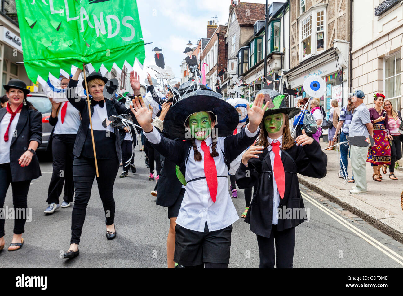 Local Children In Parade Through The Streets Of Lewes During The Annual Schools 'Moving On' Parade, High Street, Lewes, UK Stock Photo