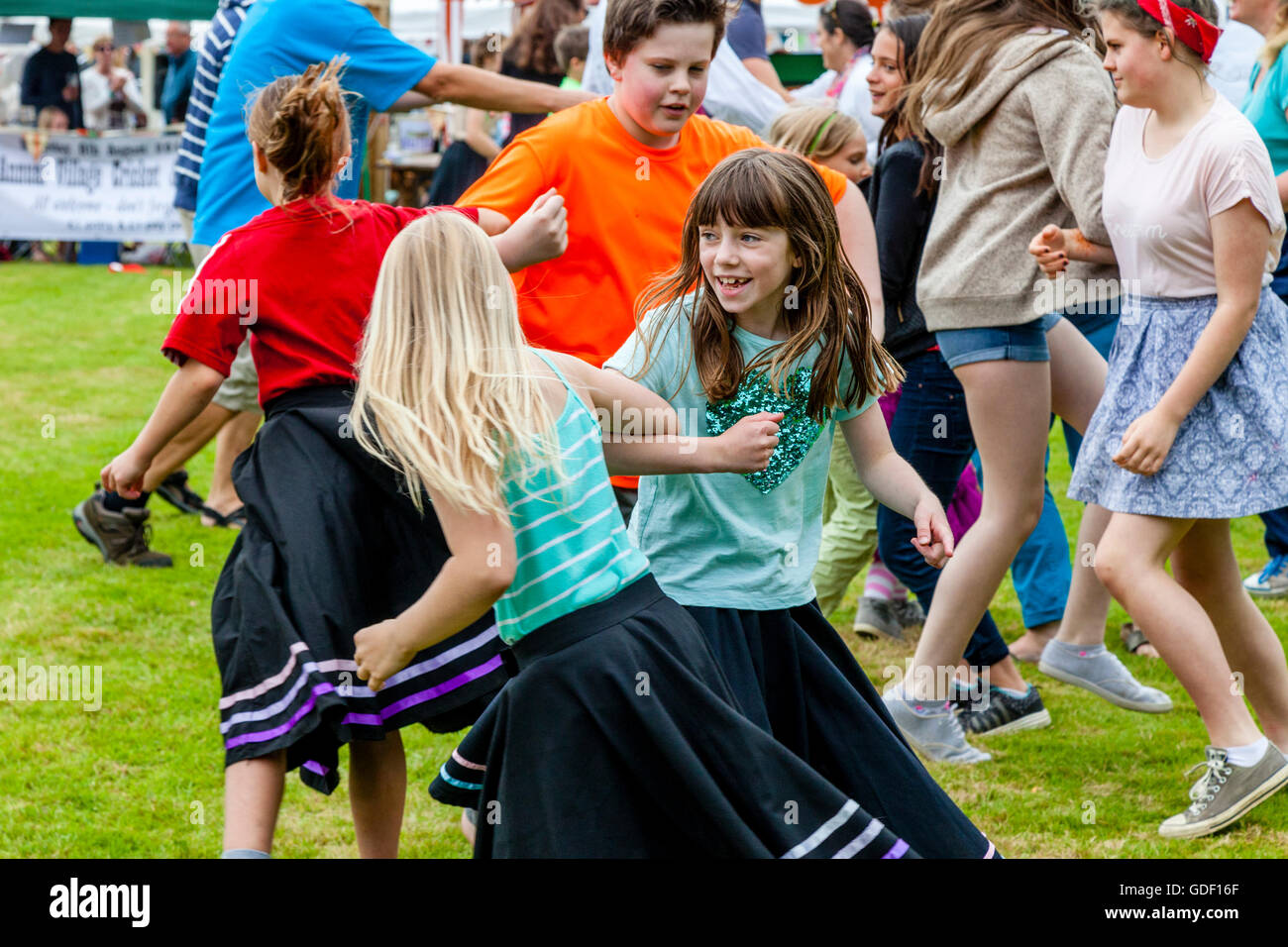 Local Children Dancing On The Village Green During The Fairwarp Village Fete, Fairwarp, East Sussex, UK Stock Photo