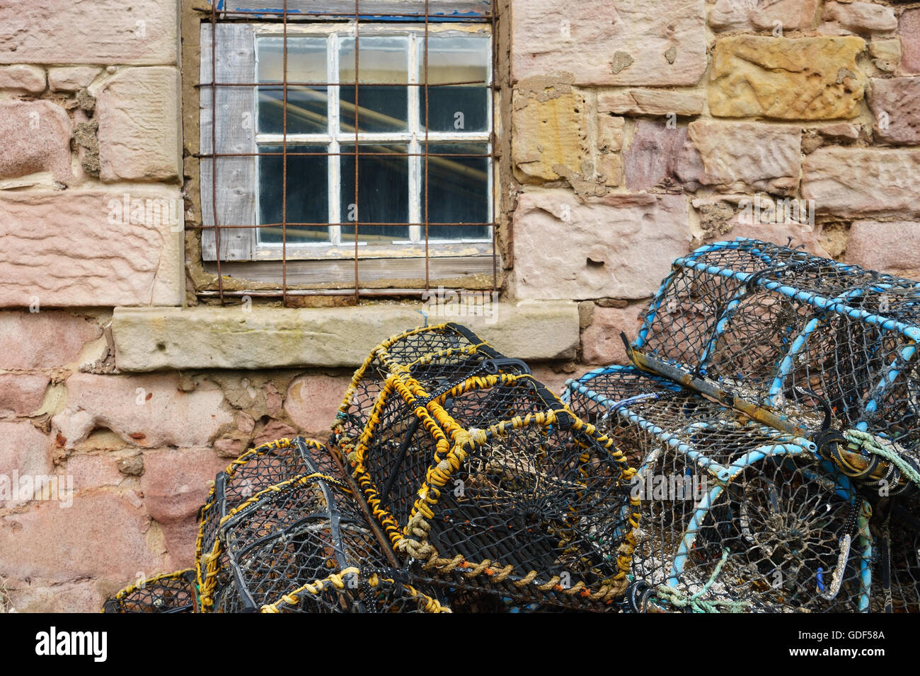 Lobster pots (creels) outside an old fisherman's cottage in Scotland. Stock Photo